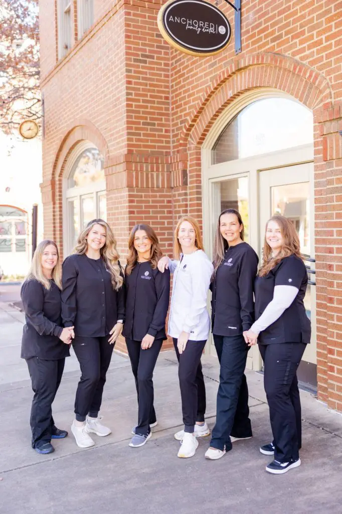 Anhored Family Dental Team in front of office